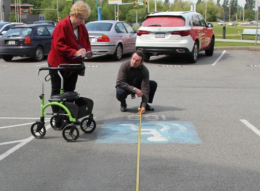 The Rick Hansen Foundation Accessibility Team at measuring parking stall accessibility