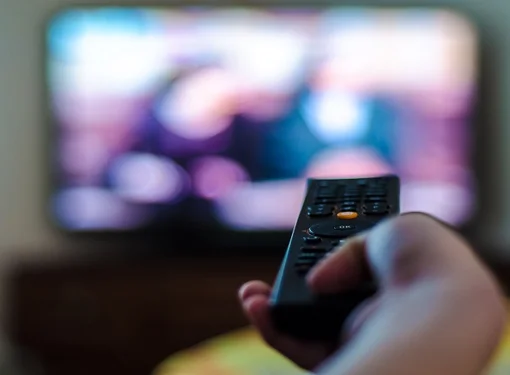 Person with vision impairments watching tv