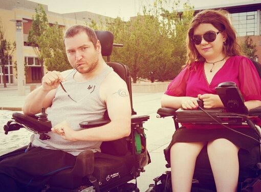 Photo of two people with disabilities