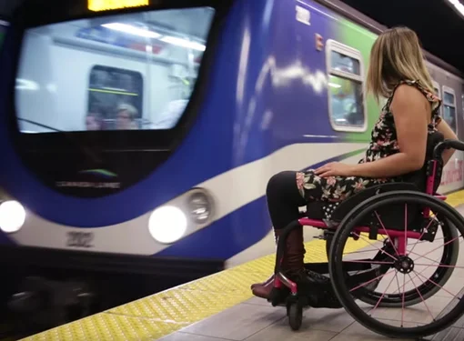 Person with disability waiting for train