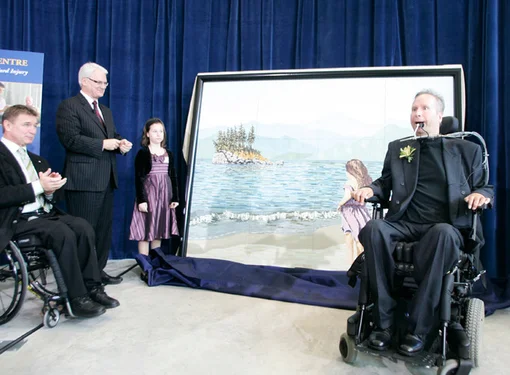 People presenting a piece of painting