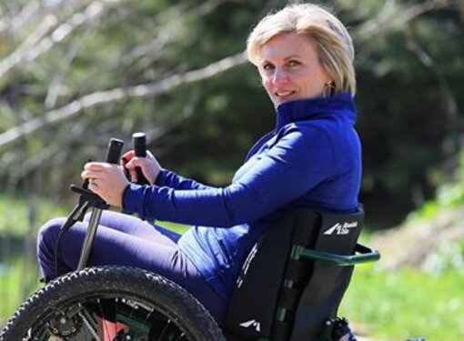 Julie using her wheelchair in the sun