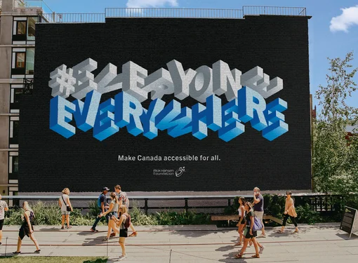 Everyone Everywhere Accessible Wall Mural people walking passed it. 