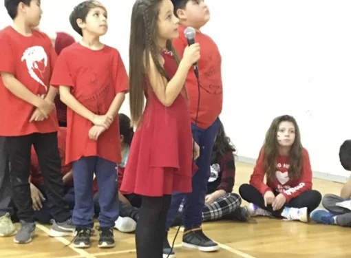 group of students speak at assembly