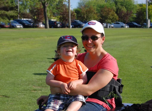 Woman and daughter posing for the camera. 