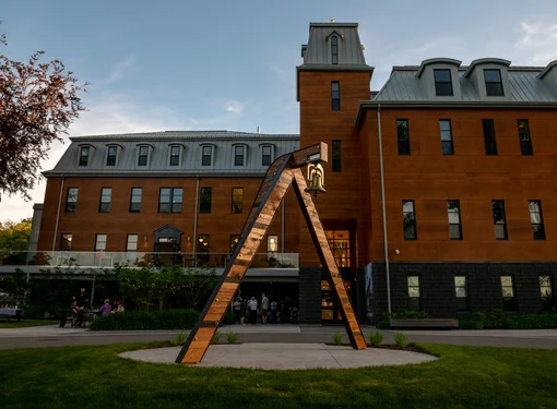  Resonance by Ursula Johnson at Eltuek Arts Centre. An inverted V-shaped art piece with a bell on the top. It is located outside of the Arts Centre. 