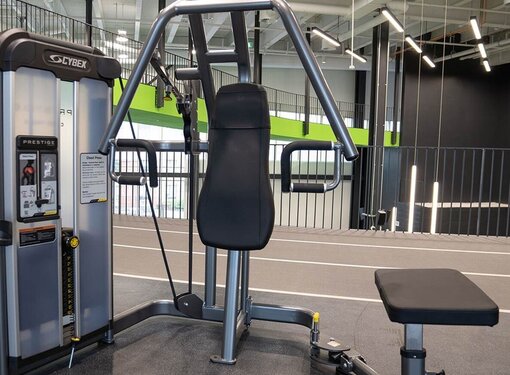 A gym machine with space to accommodate a mobility aid