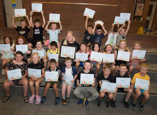 Group of children raising their hands