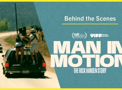 Behind-the-scenes graphic for Man In Motion: The Rick Hansen Story, showing a camera crew filming from the back of a moving vehicle as a Rick wheels along a road.