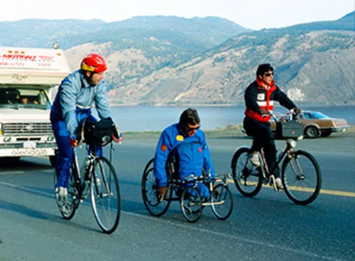 Rick Hansen, Don Alder and unknown representative from McDonald's during the Man In Motion World Tour.