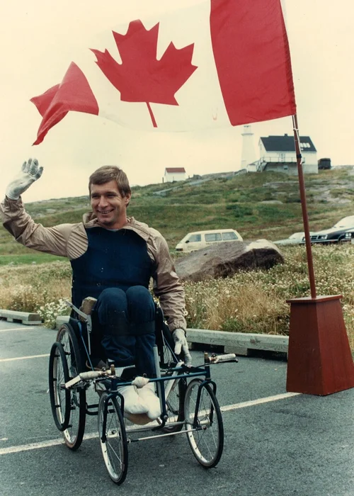 Rick next to Canada flag