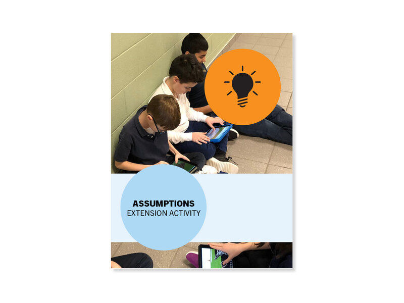 Assumptions Extension Activity, group of young students with heads bent over work, sitting in a school hallway
