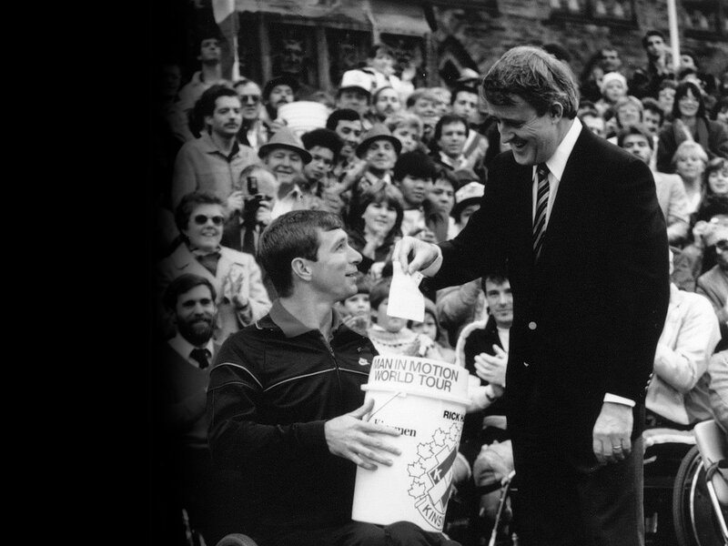 Rick Hansen receiving a $1 million dollar check from Canadian Prime Minister, Brian Mulroney.