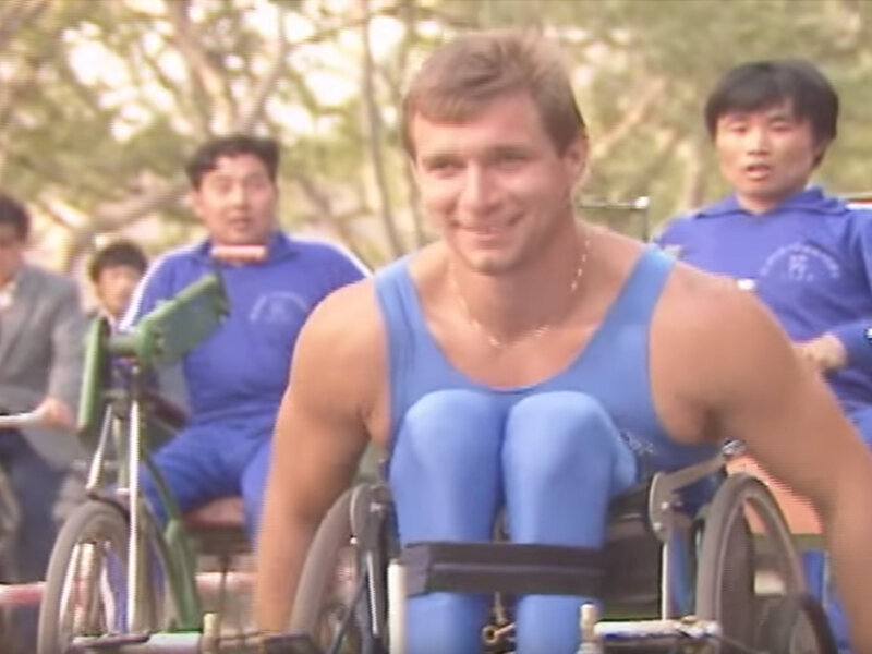 People wheeling with Rick Hansen during the Man in Motion World Tour