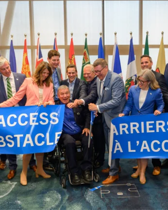 Rick Hansen among Premieres ripping and banner that says "Access Obstacles"
