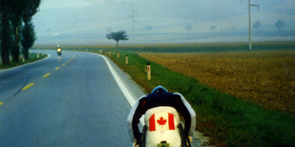 Rick Hansen wheeling down the road in West Germany during August of 1985.