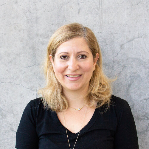 Woman in black shirt, smiling