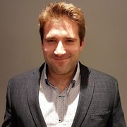 Man wearing suit, smiling