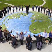 group in front of a globe
